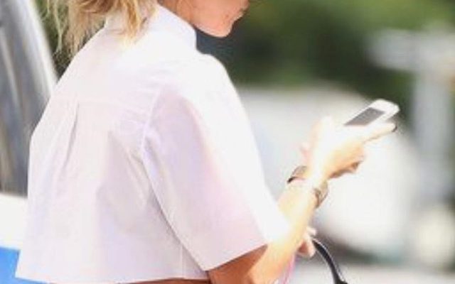 stylish girl on phone app hat white blouse